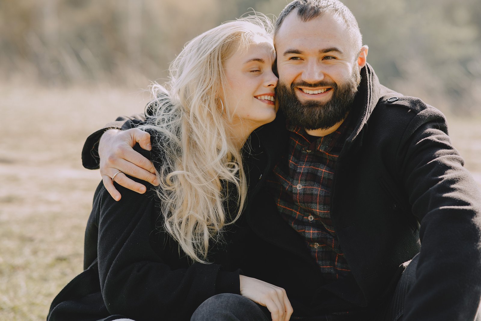 Mature couple smiling together outdoors near a cafe