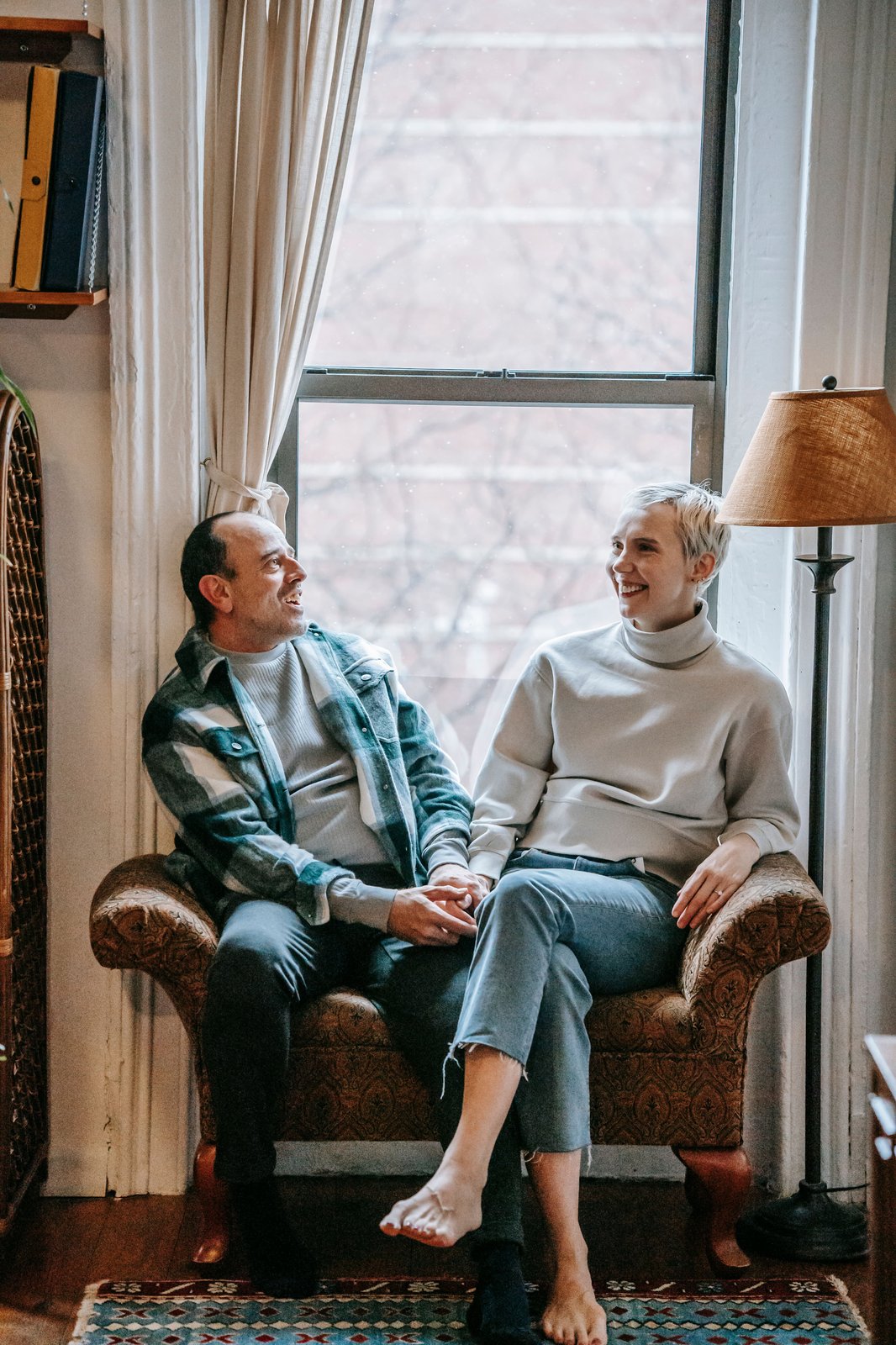 Mature couple sitting together on a park bench in autumn
